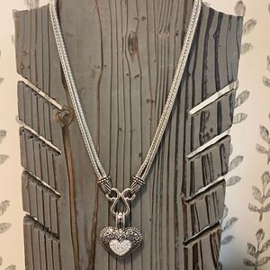 Lia Sophia silvertone necklace w/rhinestone heart. Resembles a locket but is not